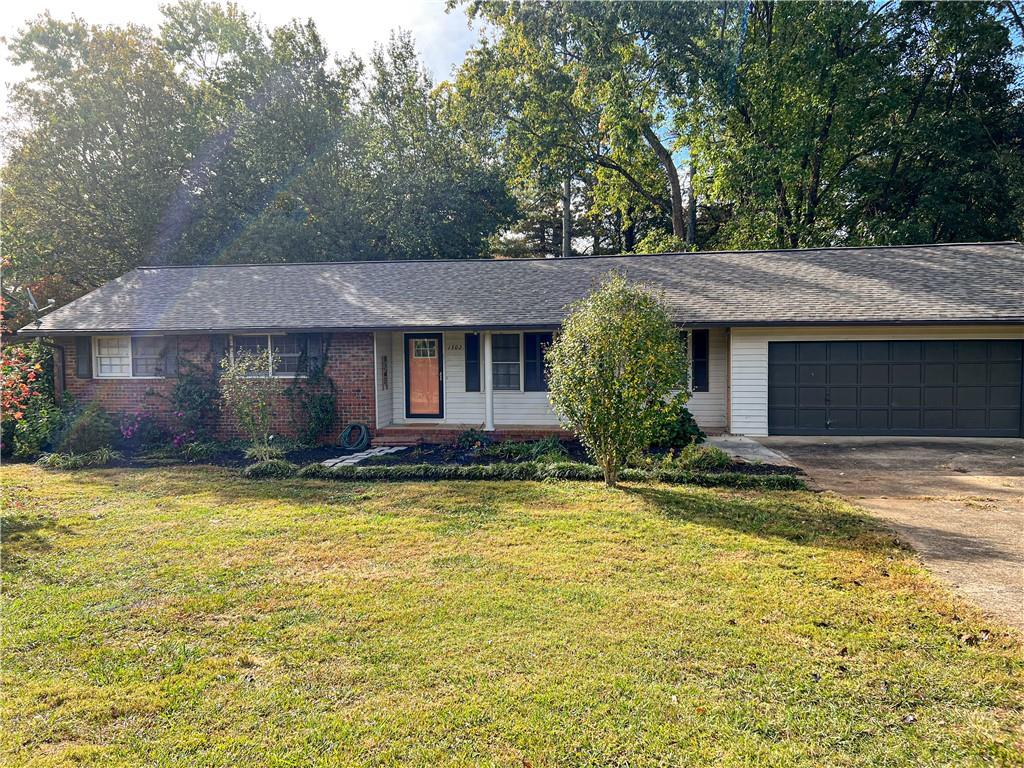 1302 Jones Mill Road Cartersville, GA 30120 - Photo 1 of 1 a view of a house with pool and a tree in front of it