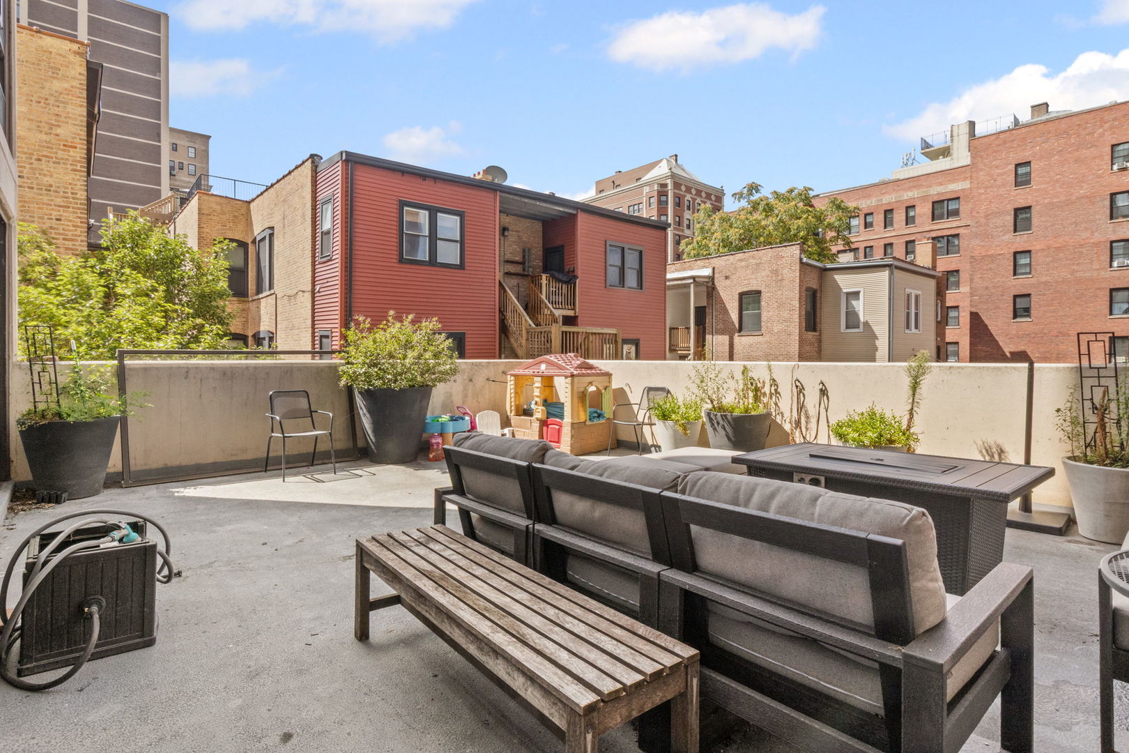 3150 North Sheridan Road, Unit 2C Chicago, IL 60657 - Photo 13 of 25 a view of a patio with couches table and chairs and potted plants