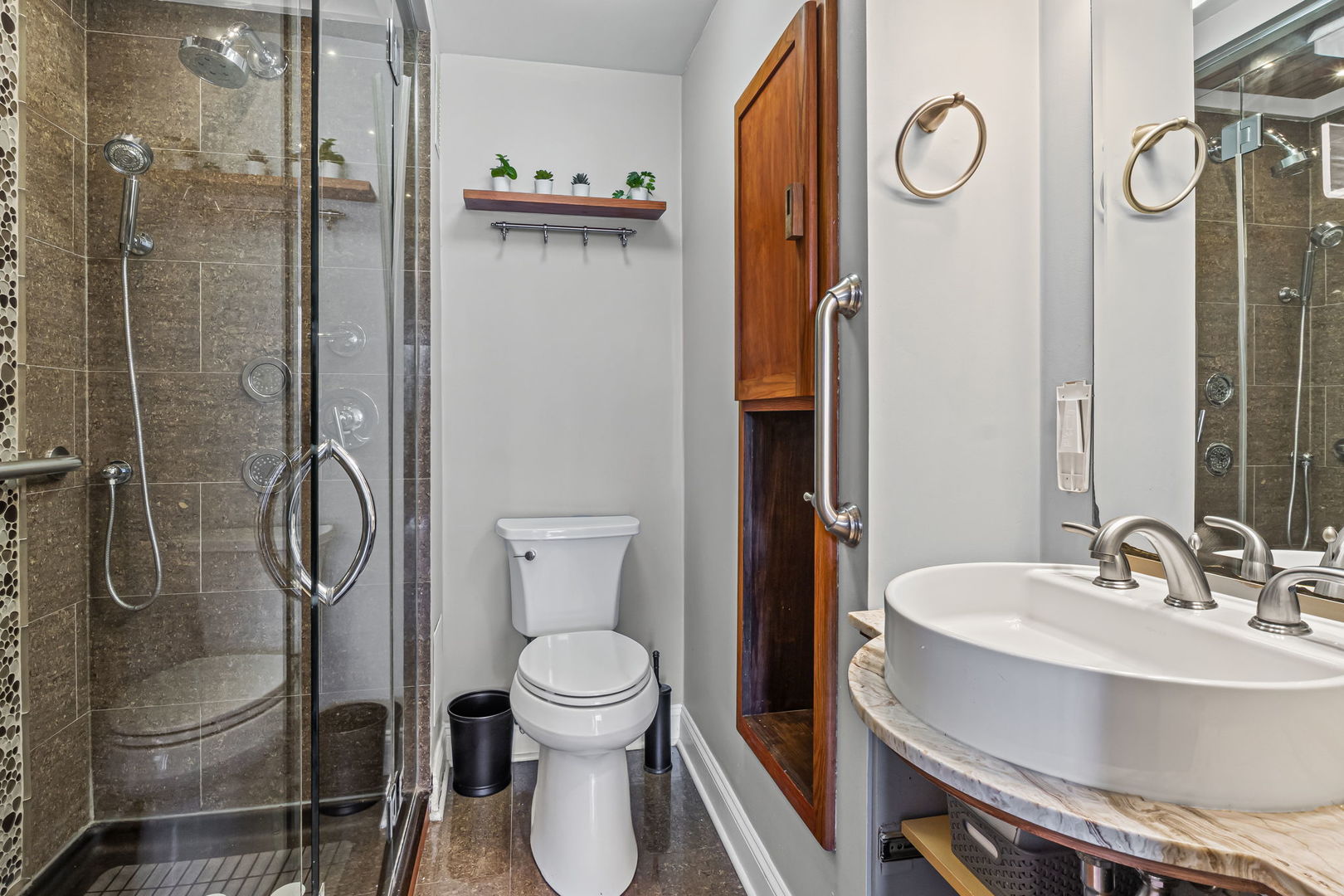 3150 North Sheridan Road, Unit 2C Chicago, IL 60657 - Photo 17 of 25 a bathroom with a toilet a sink and shower