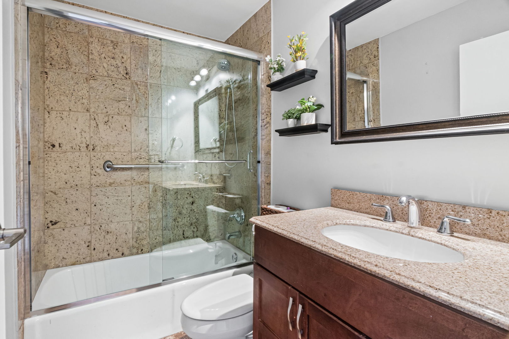 3150 North Sheridan Road, Unit 2C Chicago, IL 60657 - Photo 21 of 25 a bathroom with a granite countertop sink toilet and shower