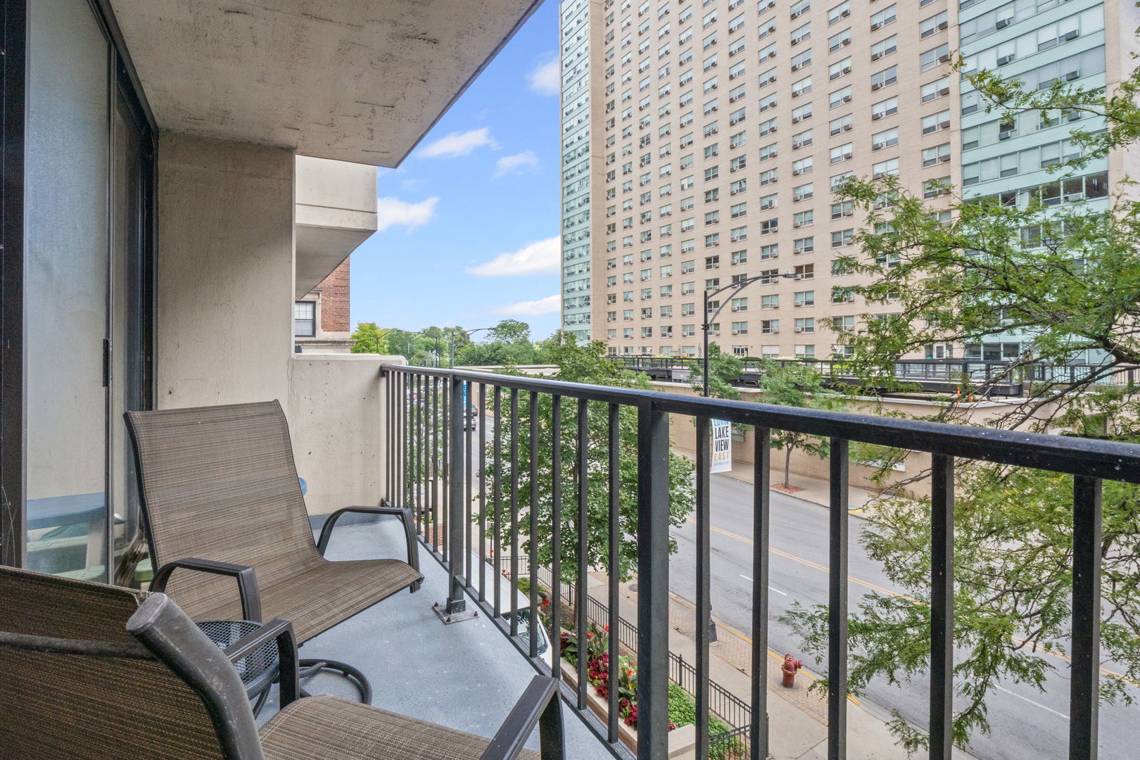3150 North Sheridan Road, Unit 2C Chicago, IL 60657 - Photo 4 of 25 a view of a balcony with furniture