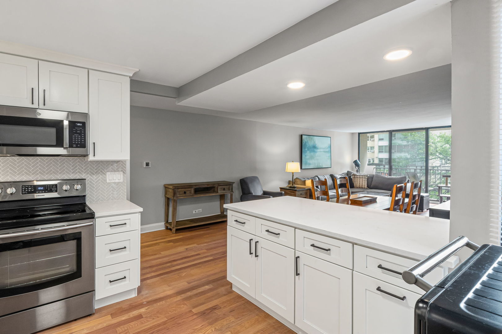 3150 North Sheridan Road, Unit 2C Chicago, IL 60657 - Photo 8 of 25 a view of kitchen with sink stainless steel appliances and cabinets