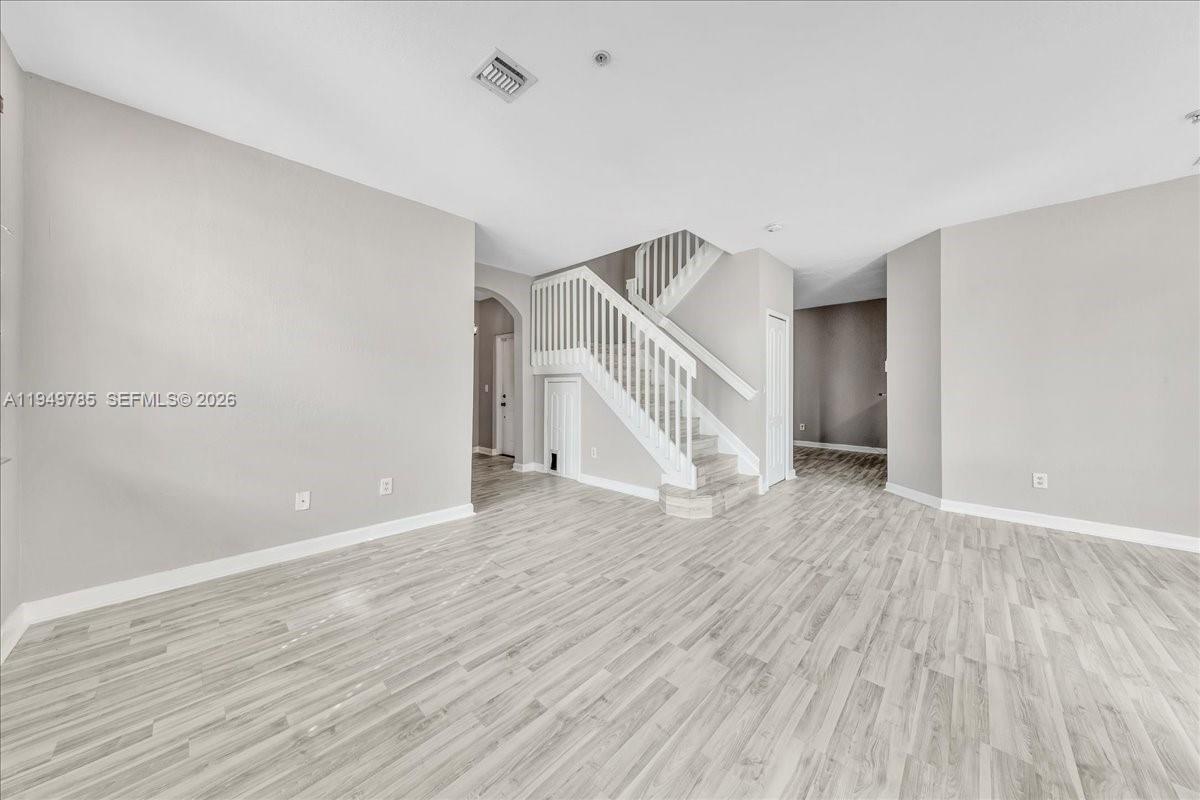 4341 Southwest 160th Avenue, Unit 201 Miramar, FL 33027 - Photo 11 of 53 a view of empty room with wooden floor