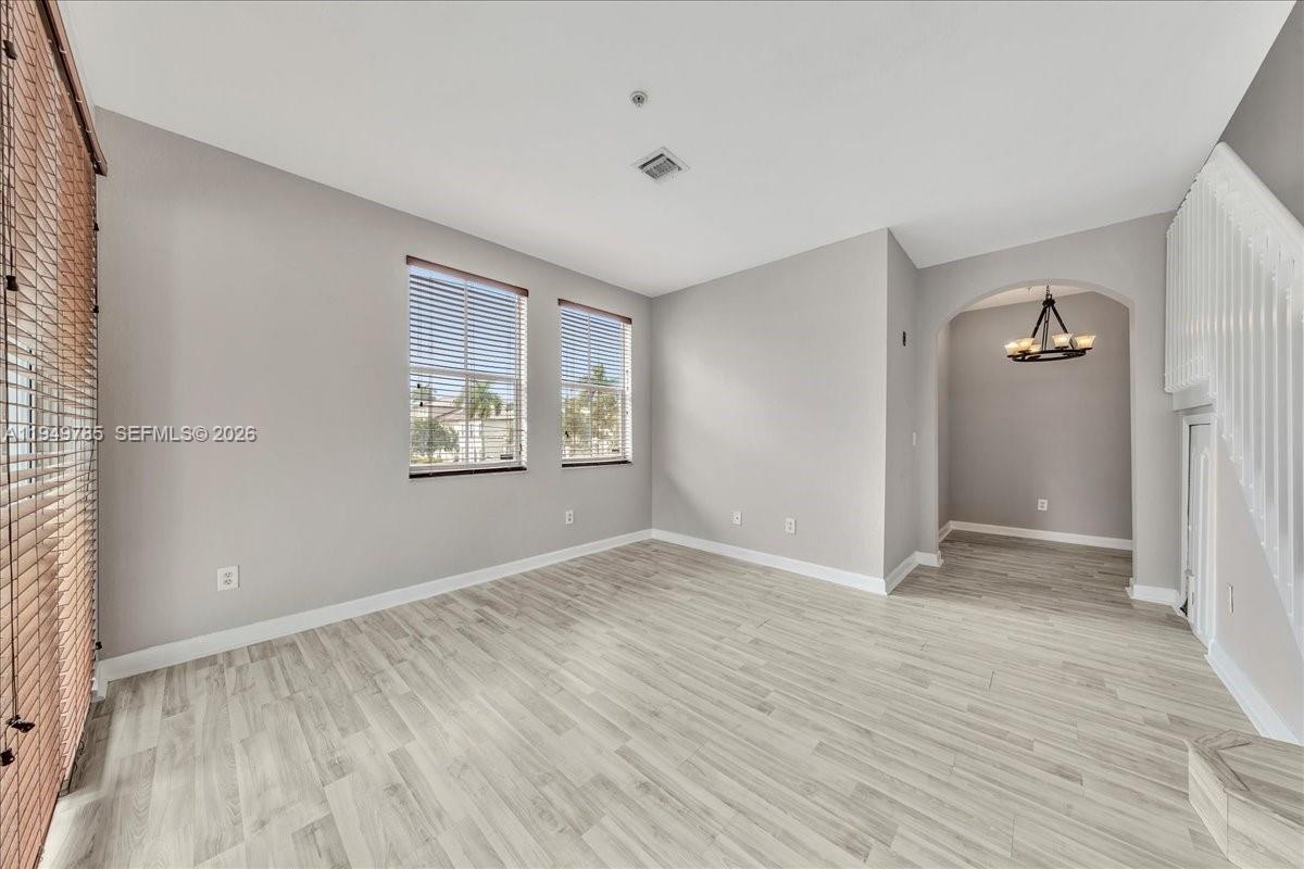 4341 Southwest 160th Avenue, Unit 201 Miramar, FL 33027 - Photo 14 of 53 an empty room with windows and closet