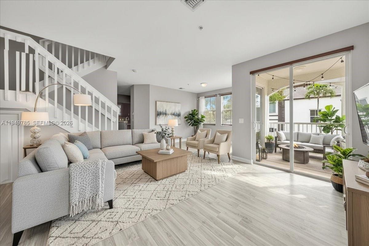 4341 Southwest 160th Avenue, Unit 201 Miramar, FL 33027 - Photo 3 of 53 a living room with furniture and wooden floor