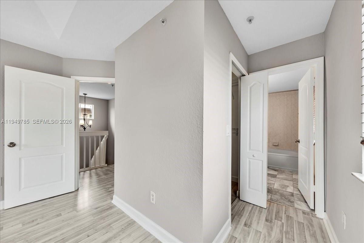 4341 Southwest 160th Avenue, Unit 201 Miramar, FL 33027 - Photo 39 of 53 a view of hallway with wooden floor