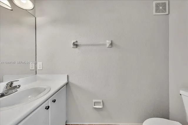 a bathroom with a sink and mirror
