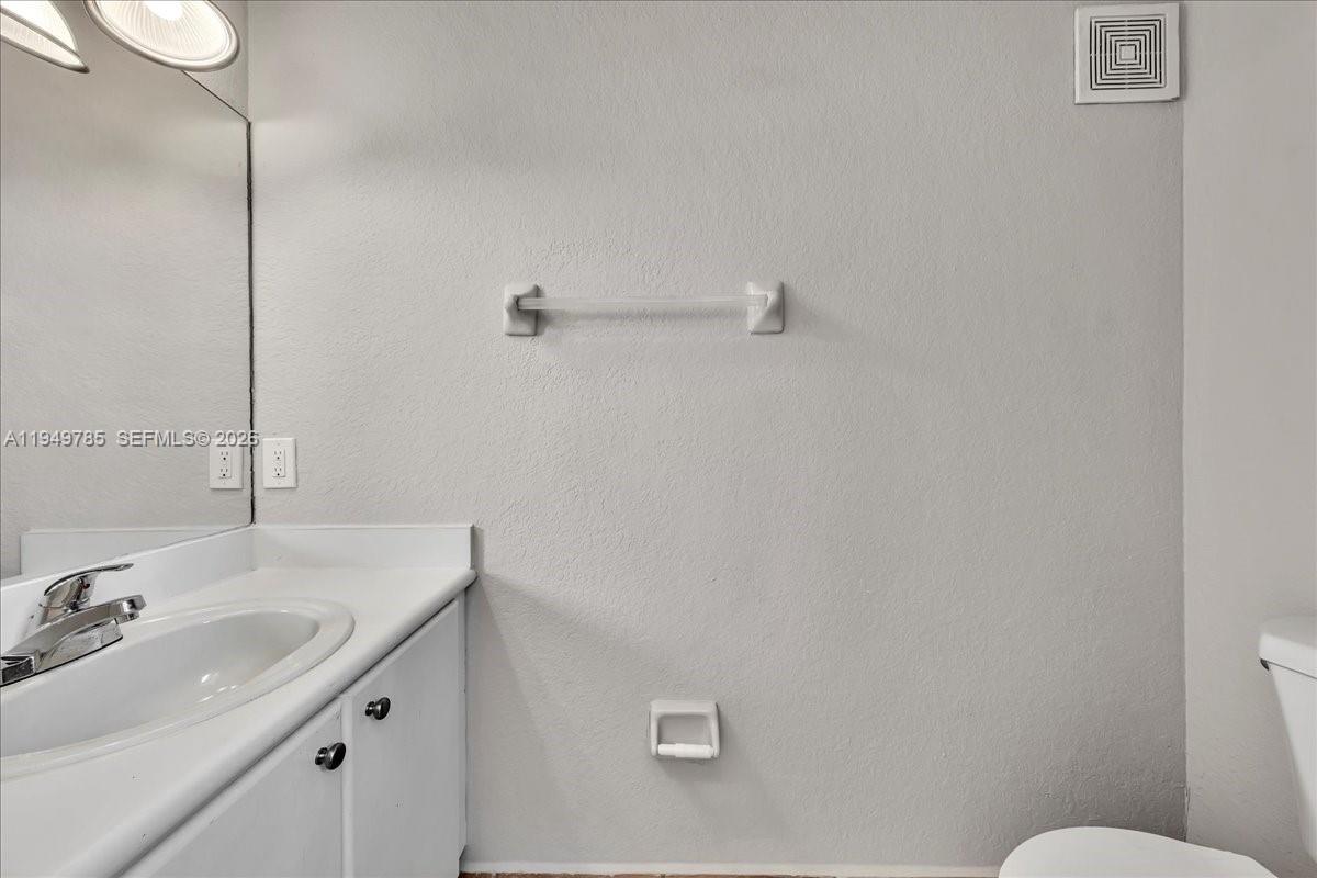 4341 Southwest 160th Avenue, Unit 201 Miramar, FL 33027 - Photo 43 of 53 a bathroom with a sink and mirror