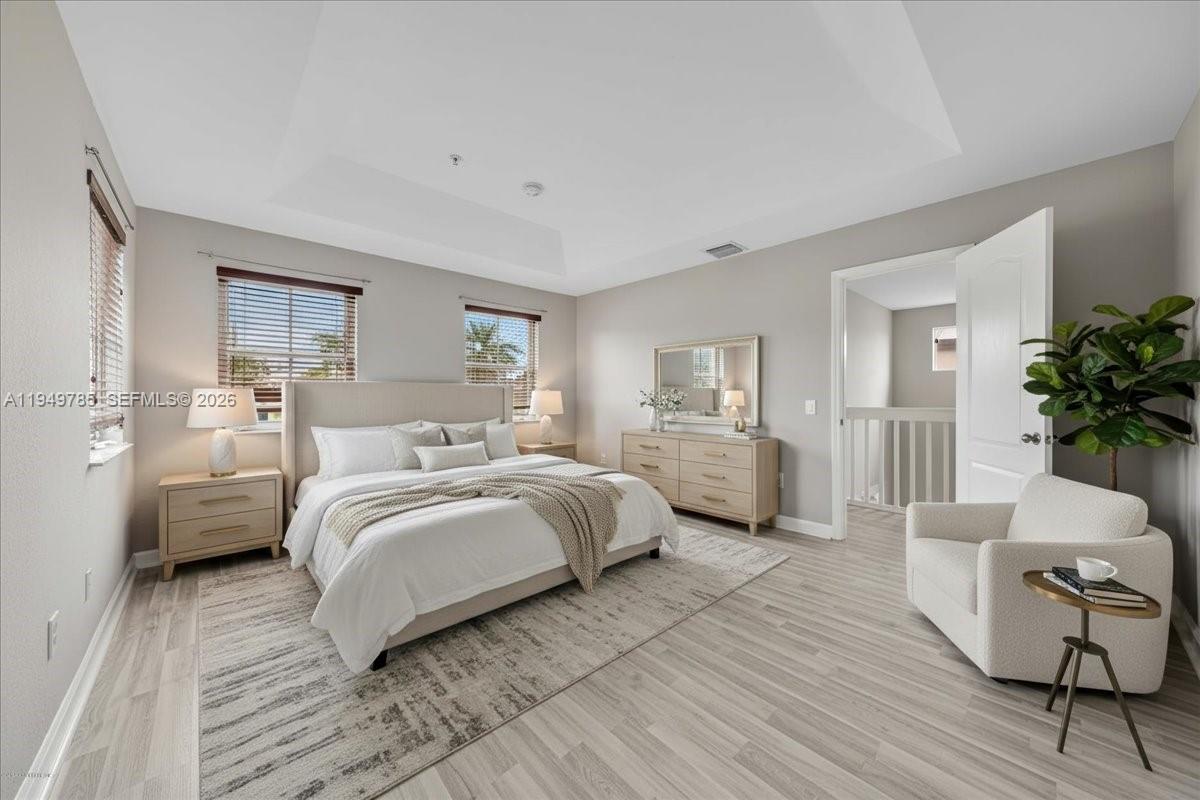 4341 Southwest 160th Avenue, Unit 201 Miramar, FL 33027 - Photo 5 of 53 a bedroom with a large bed and windows