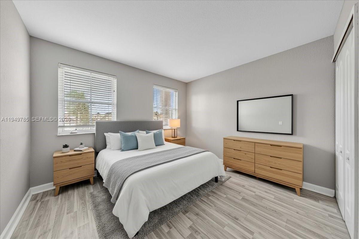 4341 Southwest 160th Avenue, Unit 201 Miramar, FL 33027 - Photo 7 of 53 a bedroom with a bed and a window