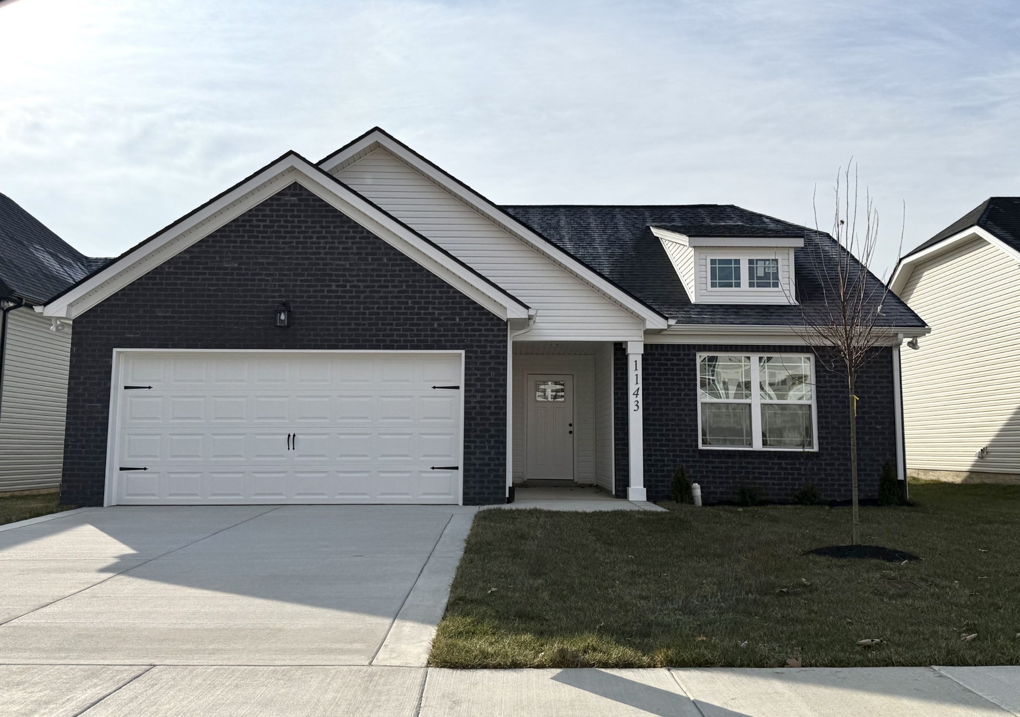 a front view of a house with a yard