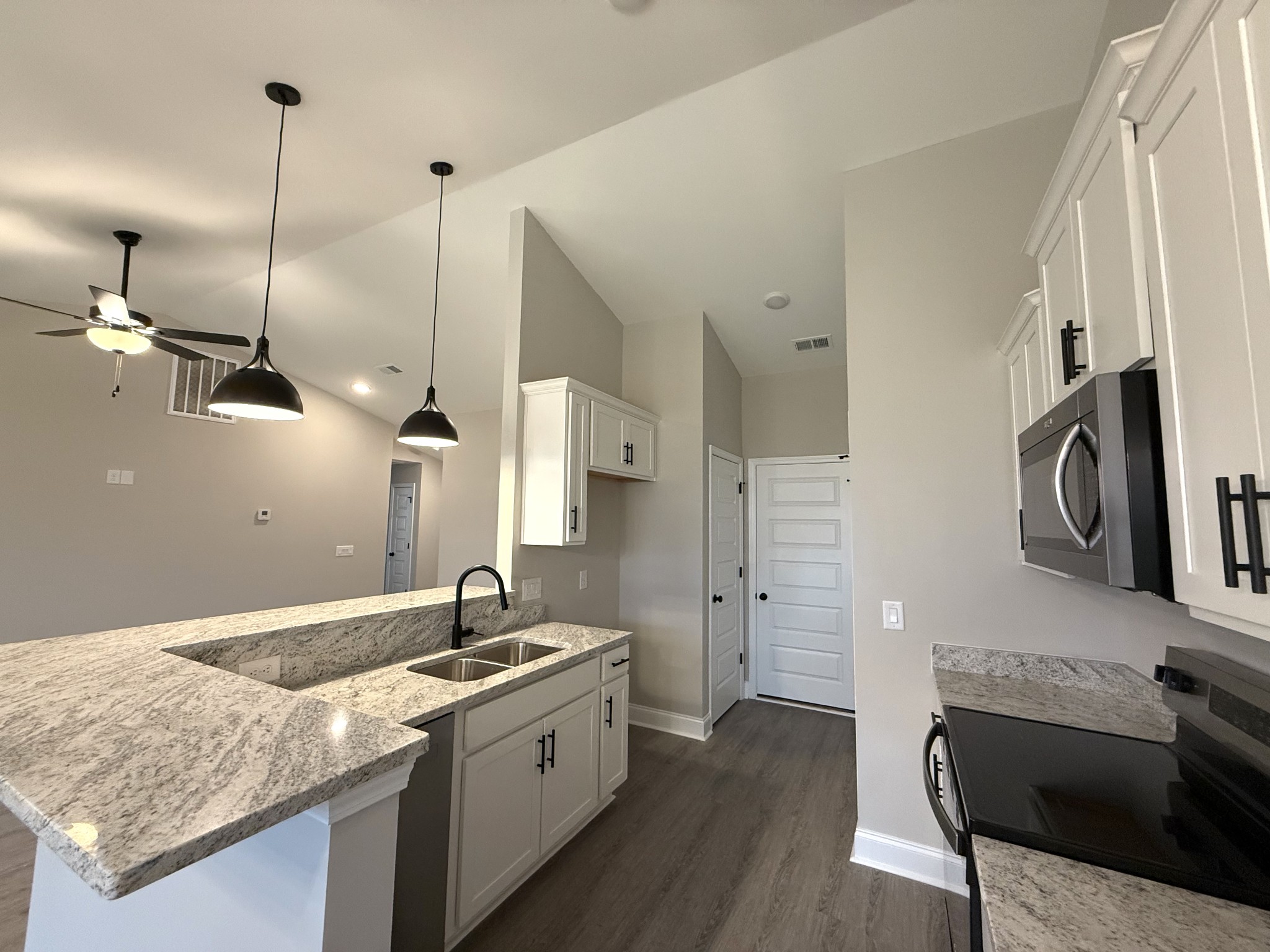 1143 Javier Drive Springfield, TN 37172 - Photo 2 of 7 a kitchen with a sink stainless steel appliances and wooden floor