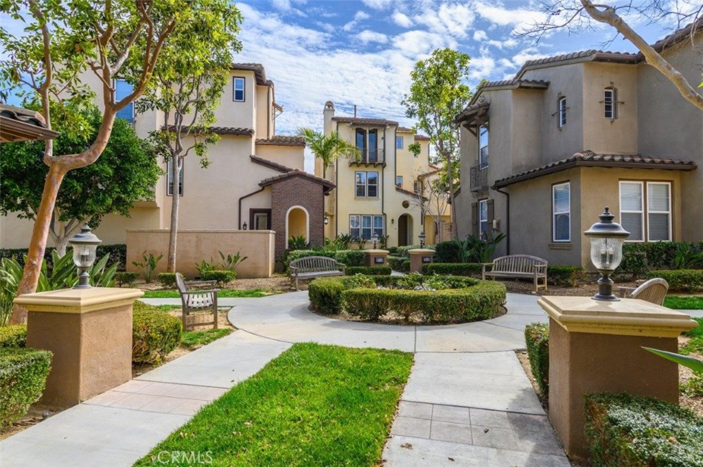 15 Tall Oak Irvine, CA 92603 - Photo 46 of 66 a front view of a house with a garden