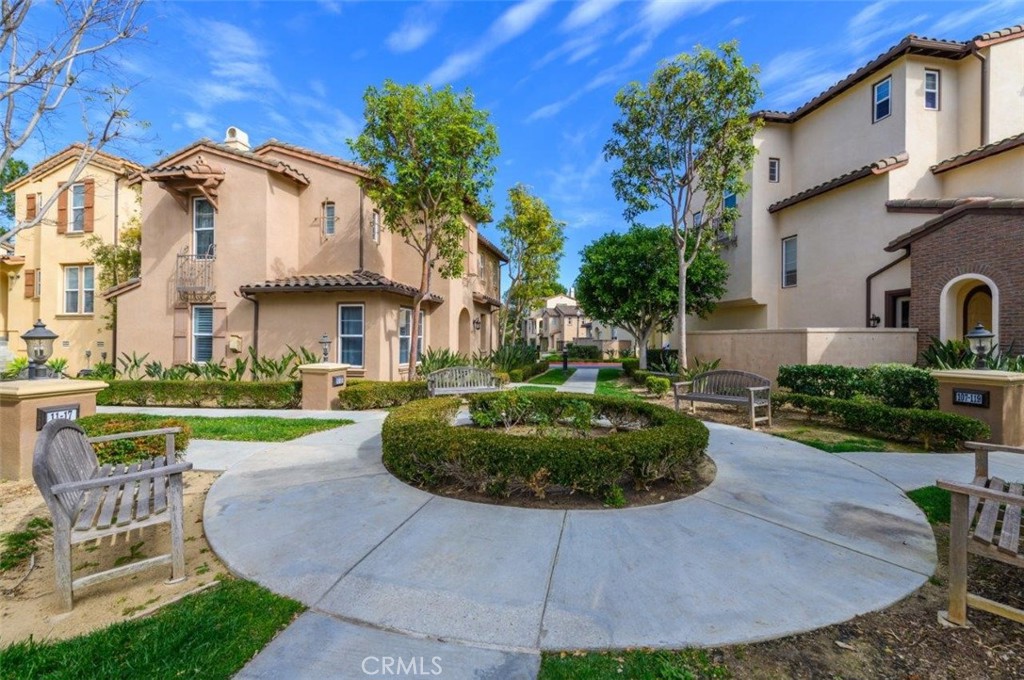 15 Tall Oak Irvine, CA 92603 - Photo 47 of 66 a view of a house with garden and a sitting area