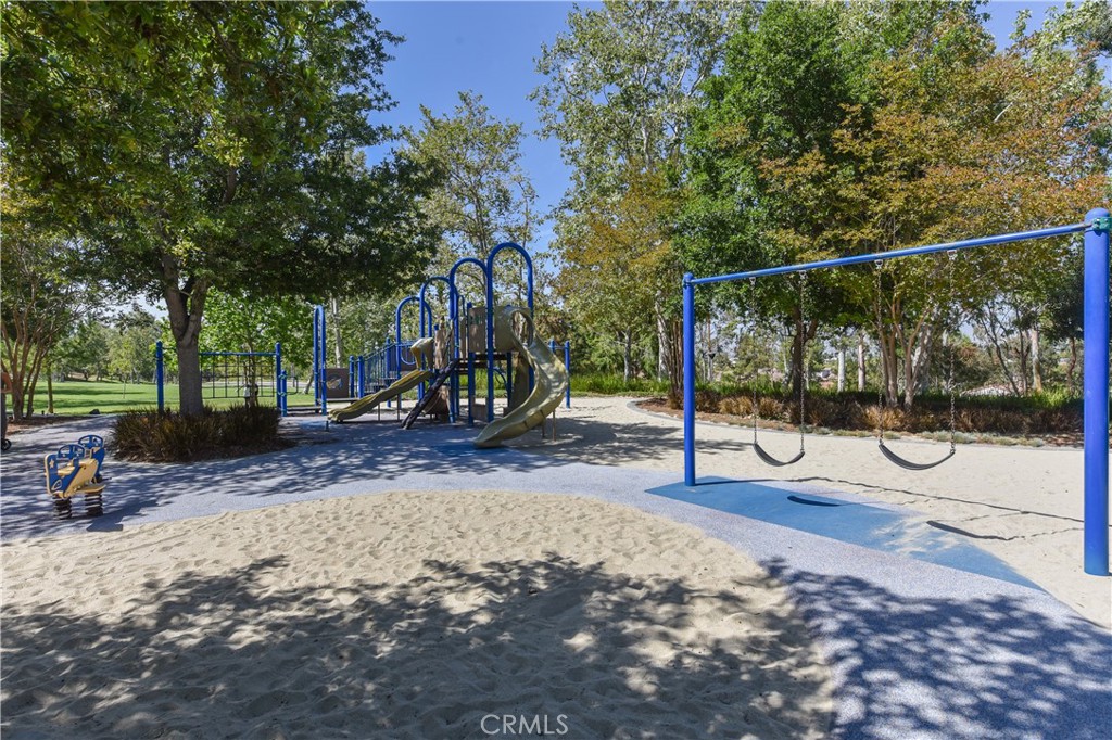 15 Tall Oak Irvine, CA 92603 - Photo 61 of 66 a view of a park with swings and slides