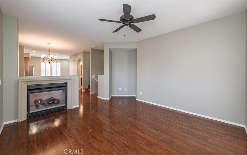 15 Tall Oak Irvine, CA 92603 - Photo 8 of 66 a view of empty room with wooden floor and a fireplace
