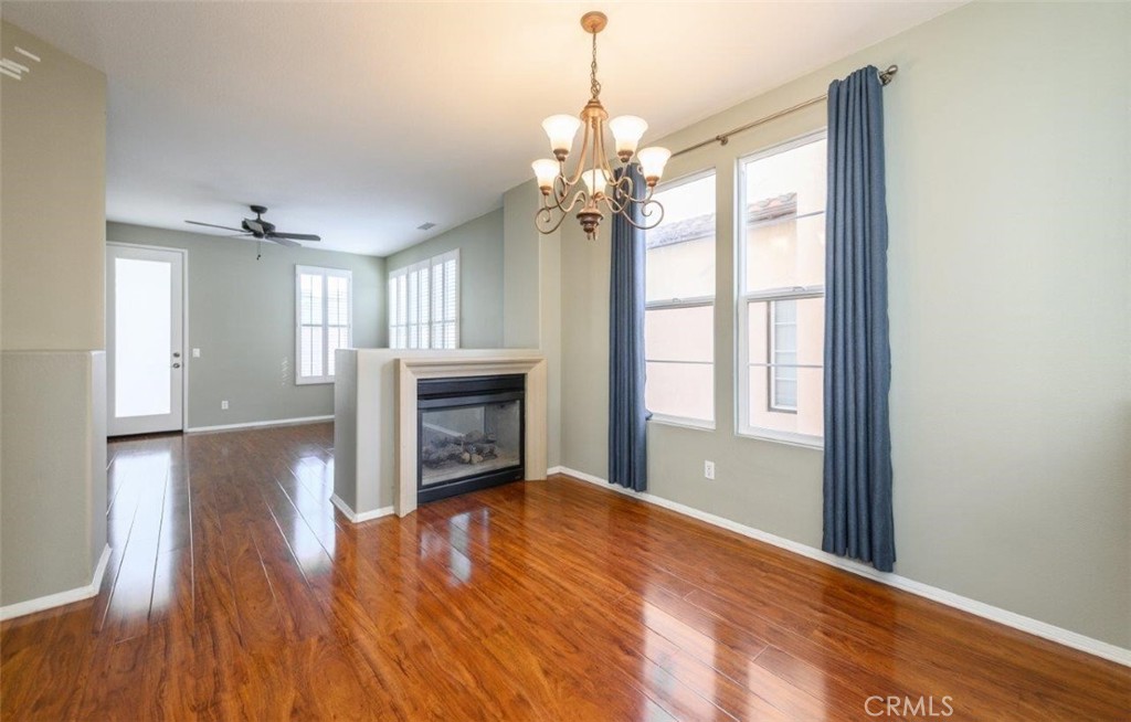 15 Tall Oak Irvine, CA 92603 - Photo 9 of 66 a view of an empty room with window and wooden floor