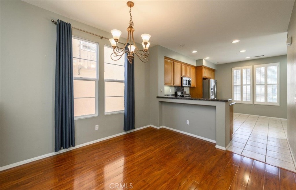 15 Tall Oak Irvine, CA 92603 - Photo 10 of 66 a view of a kitchen with cabinet and a ceiling fan