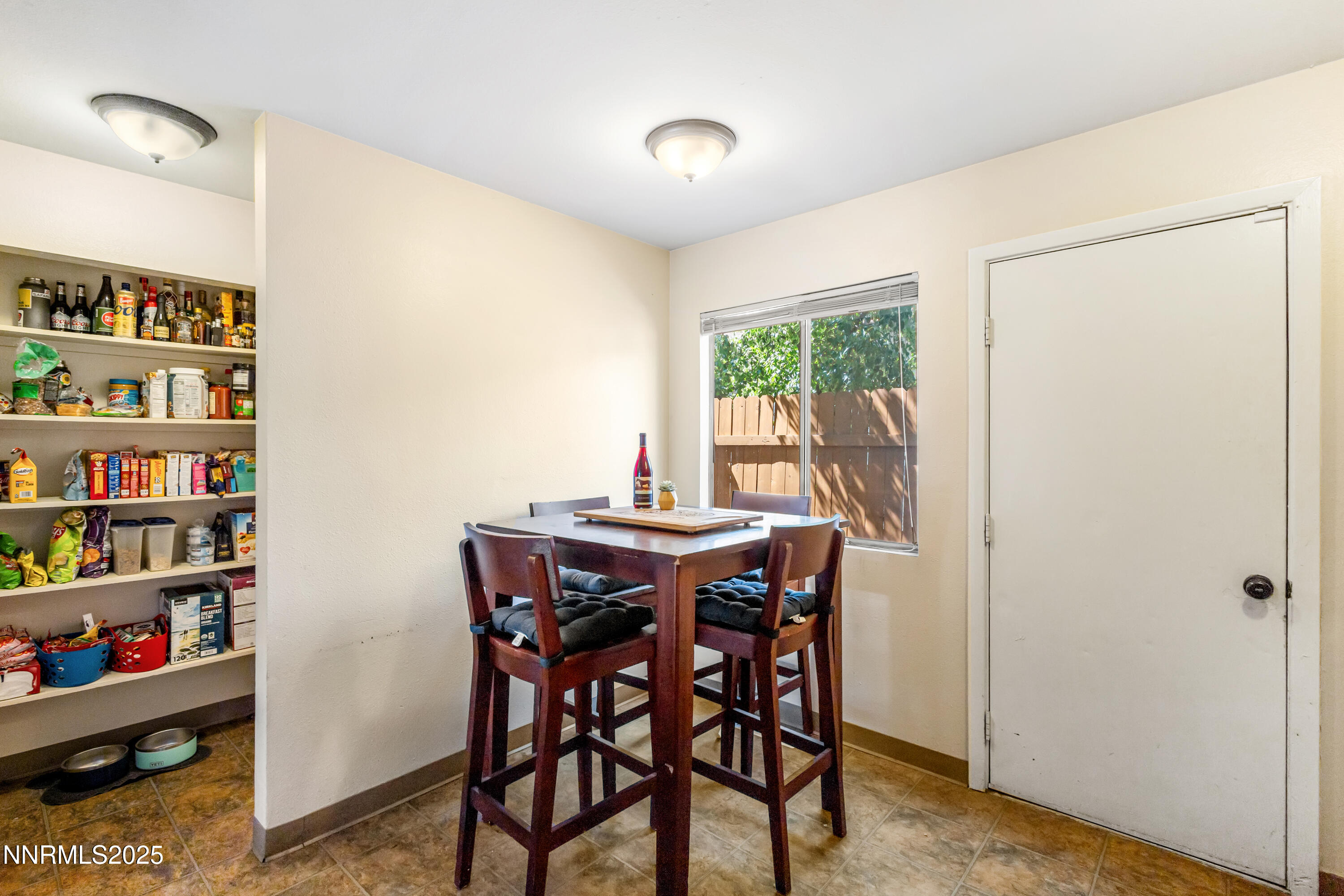 1414 East 9th Street, Unit 4 Reno, NV 89512 - Photo 7 of 16 a view of a dining room with furniture window and outside view