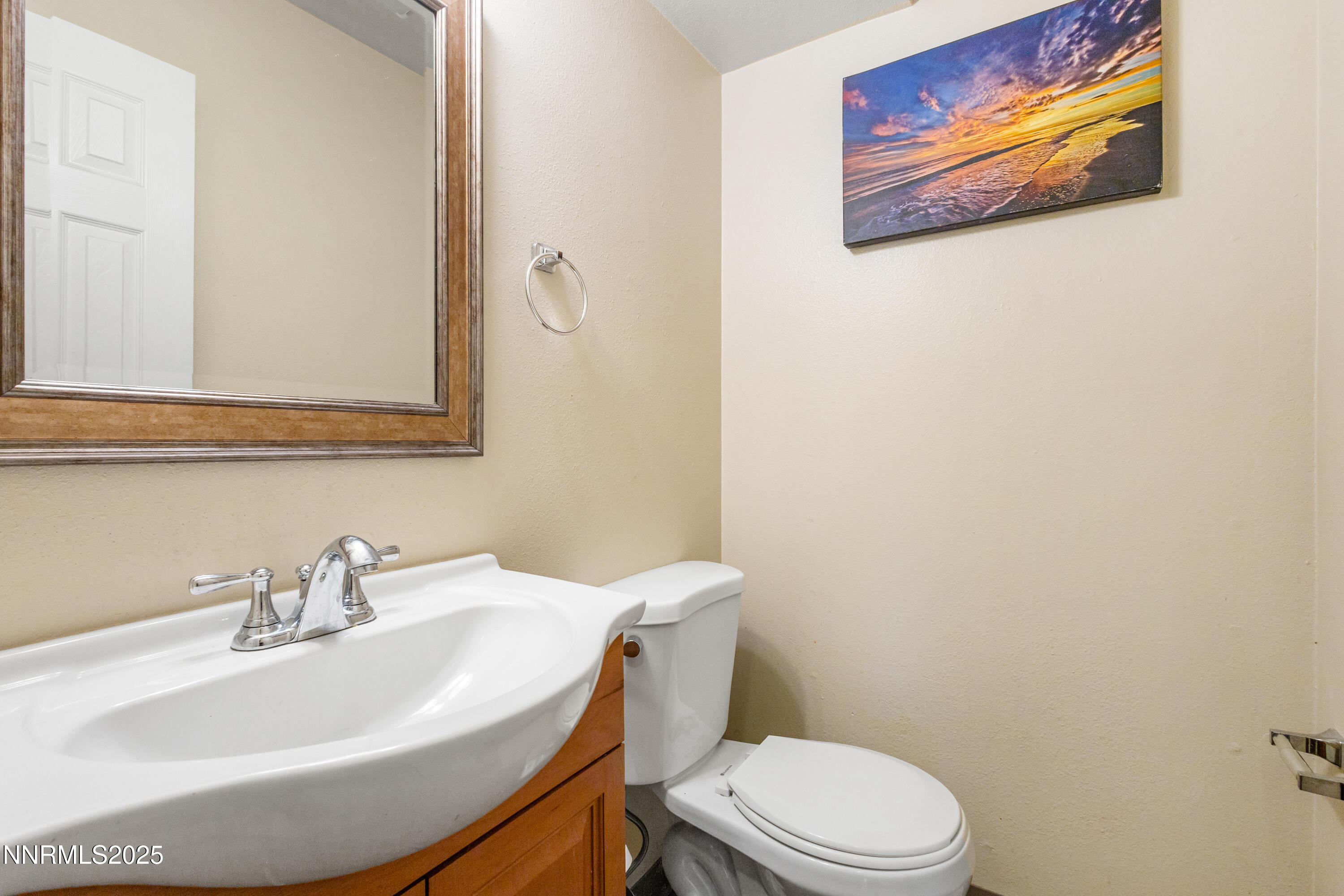1414 East 9th Street, Unit 4 Reno, NV 89512 - Photo 8 of 16 a bathroom with a sink mirror and toilet