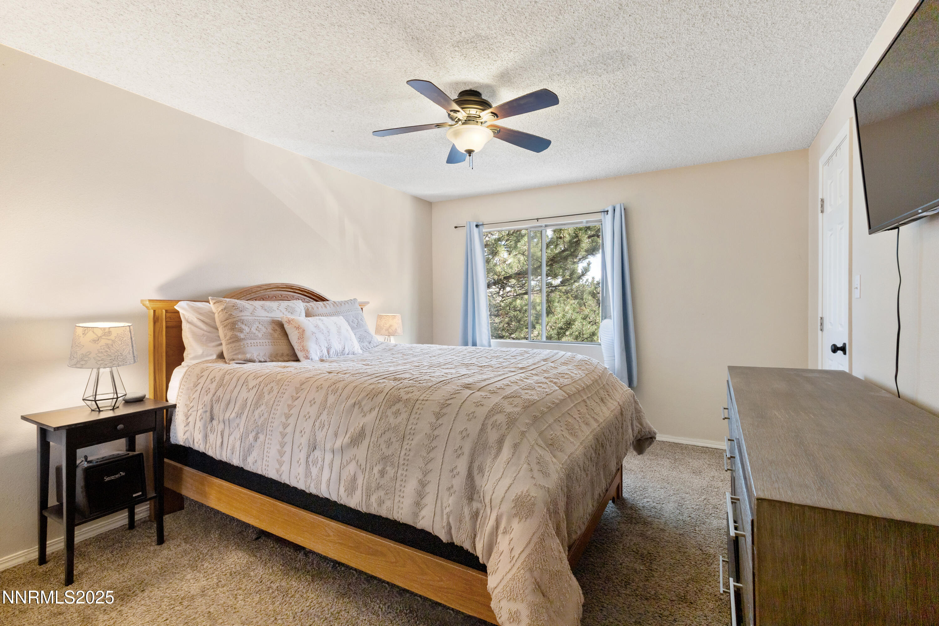 1414 East 9th Street, Unit 4 Reno, NV 89512 - Photo 9 of 16 a bedroom with a bed and window