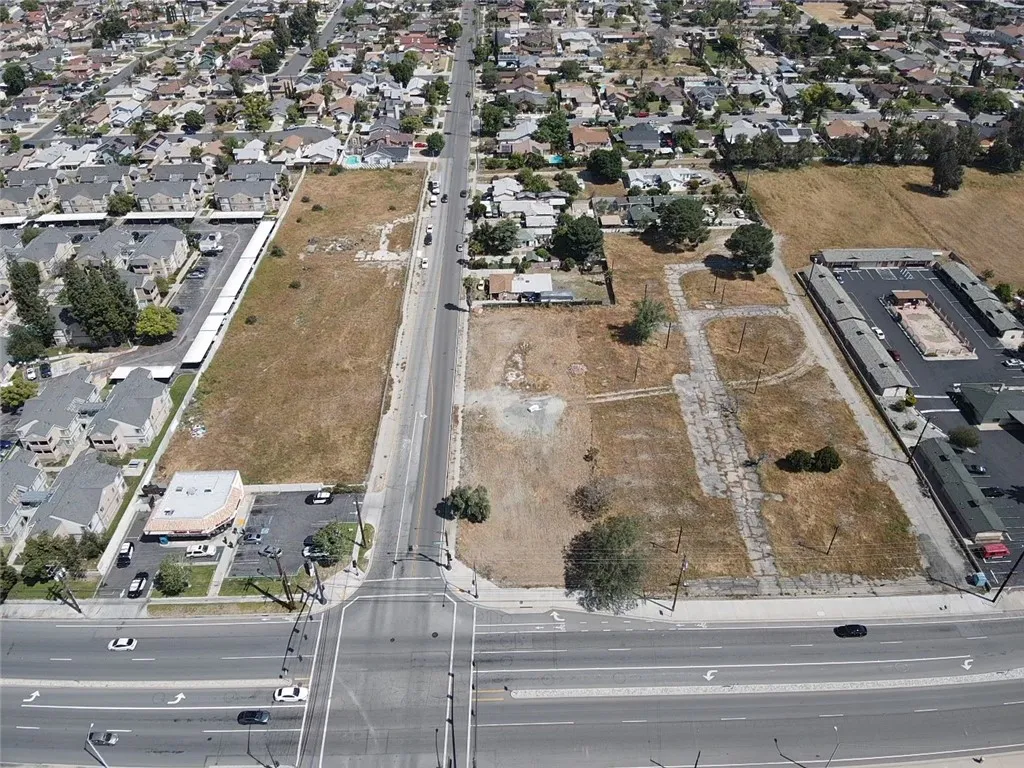 16304 Foothill Fontana, CA 92335 - Photo 3 of 36 an aerial view of residential houses with outdoor space