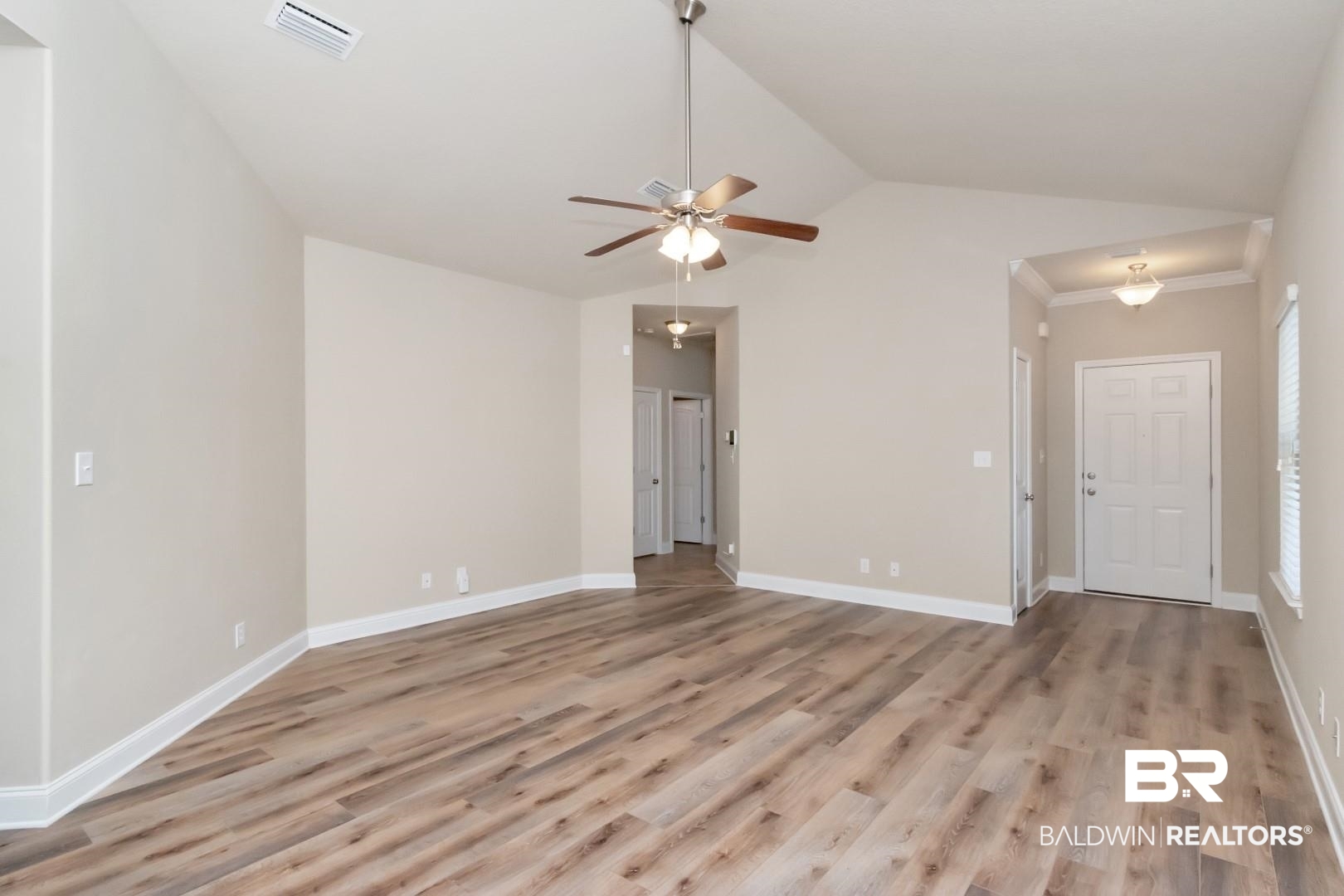 6144 Whitebark Drive Mobile, AL 36693 - Photo 5 of 33 Empty room with light wood-type flooring, ceiling fan, and lofted ceiling