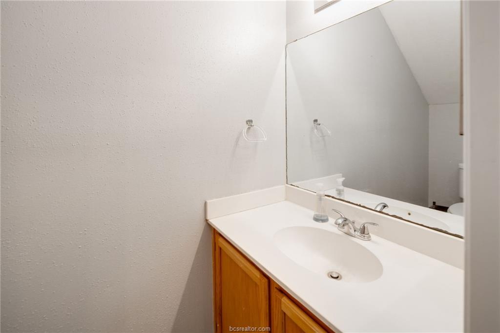 1501 Stallings Drive, Unit 60 College Station, TX 77840 - Photo 13 of 17 a bathroom with a sink and a mirror