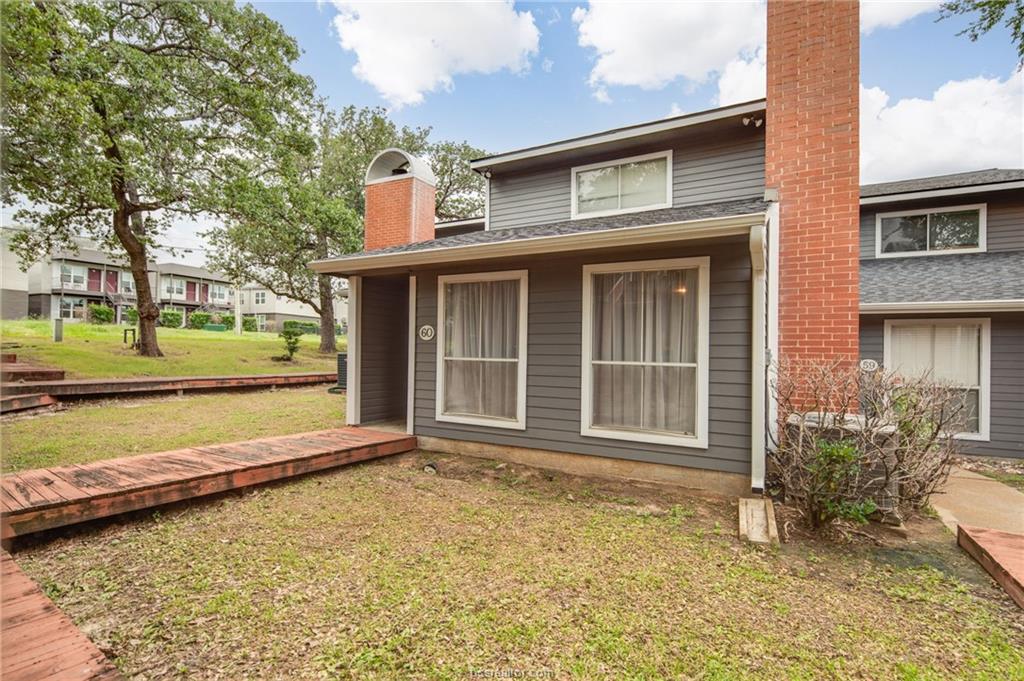 1501 Stallings Drive, Unit 60 College Station, TX 77840 - Photo 17 of 17 a front view of a house with a yard
