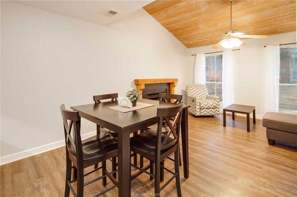 1501 Stallings Drive, Unit 60 College Station, TX 77840 - Photo 4 of 17 a view of a dining room with furniture and wooden floor
