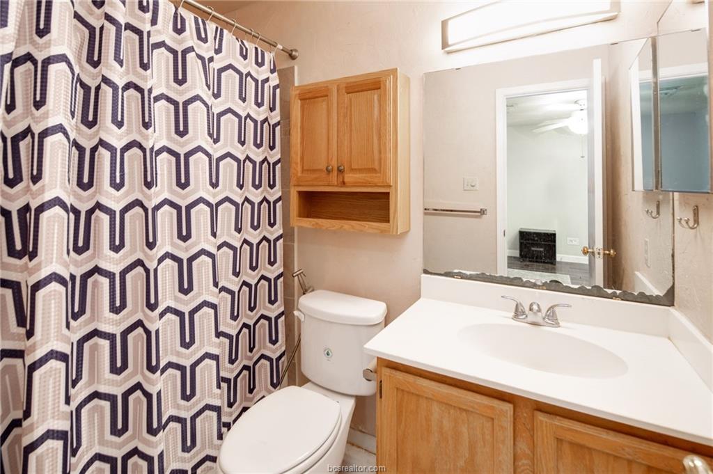 1501 Stallings Drive, Unit 60 College Station, TX 77840 - Photo 10 of 17 a bathroom with a sink and a mirror