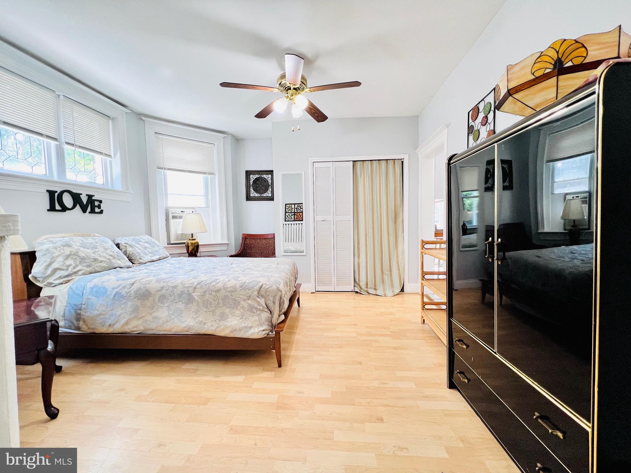 a bedroom with a bed and a walk in closet