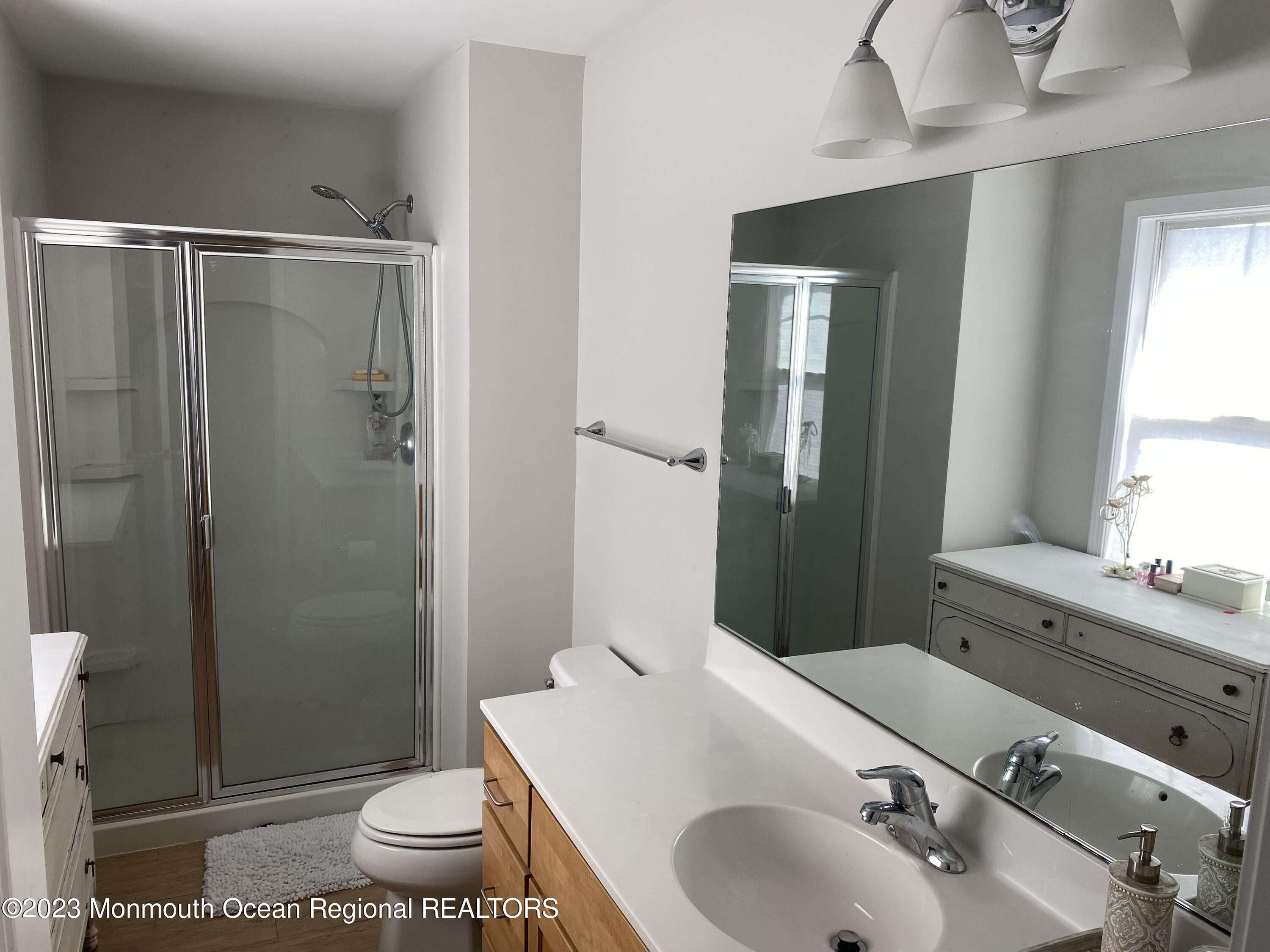 59 Court Street, Unit 2 Long Branch, NJ 07740 - Photo 7 of 8 a bathroom with a sink toilet and shower
