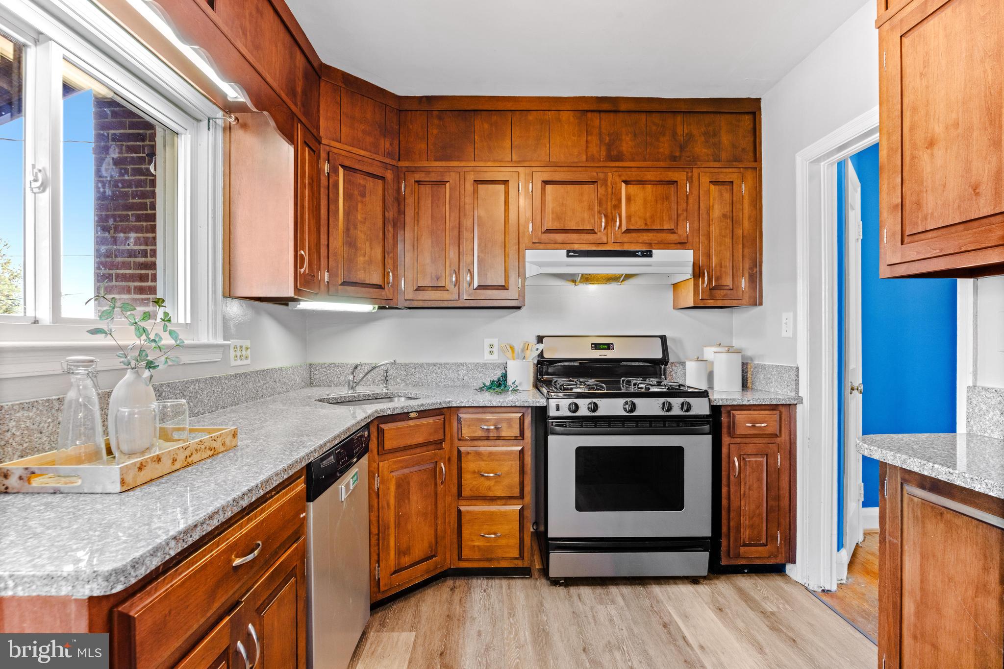 1840 Deveron Road Towson, MD 21286 - Photo 16 of 43 a kitchen with stainless steel appliances granite countertop a stove and a sink
