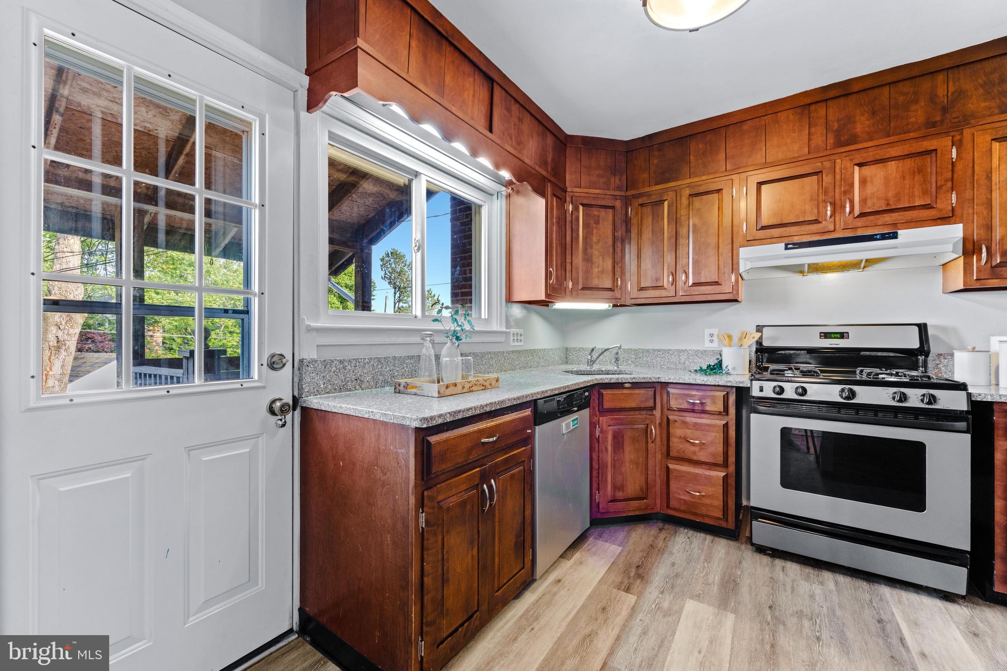 1840 Deveron Road Towson, MD 21286 - Photo 19 of 43 a kitchen with stainless steel appliances granite countertop a stove and a sink