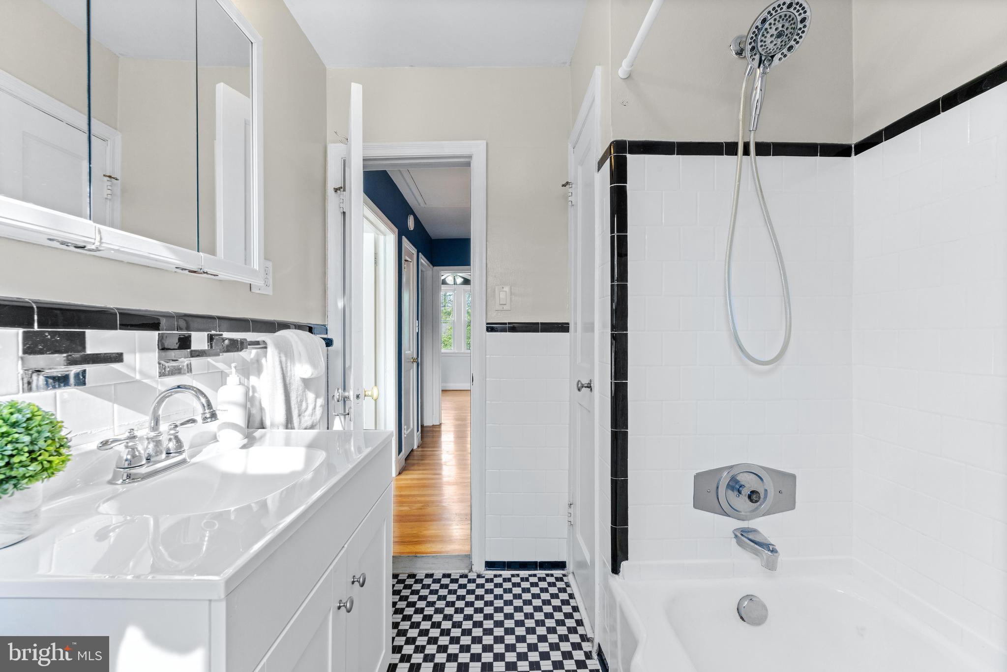 1840 Deveron Road Towson, MD 21286 - Photo 26 of 43 a bathroom with a granite countertop sink a mirror and shower