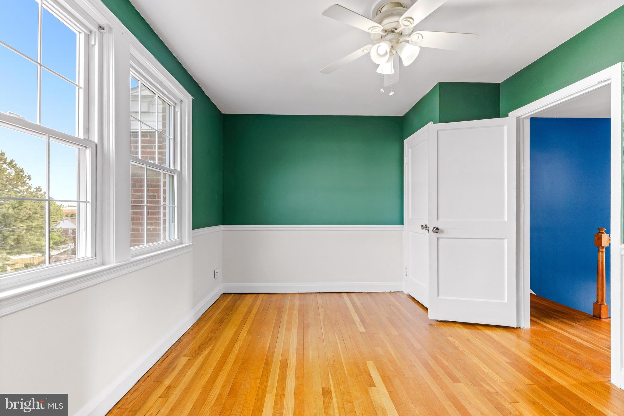 1840 Deveron Road Towson, MD 21286 - Photo 32 of 43 a view of a room with wooden floor ceiling fan and windows
