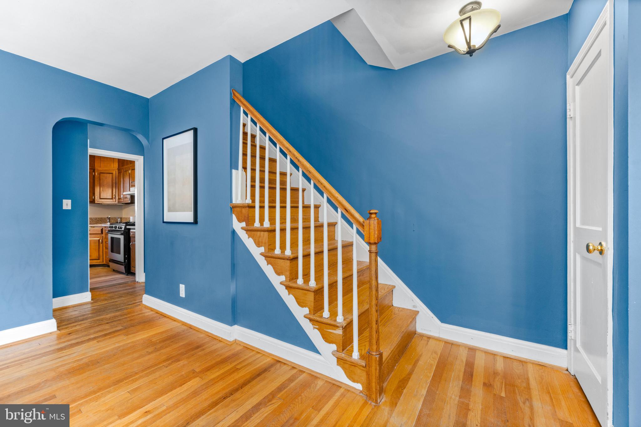 1840 Deveron Road Towson, MD 21286 - Photo 9 of 43 a view of a hallway with wooden floor and stairs