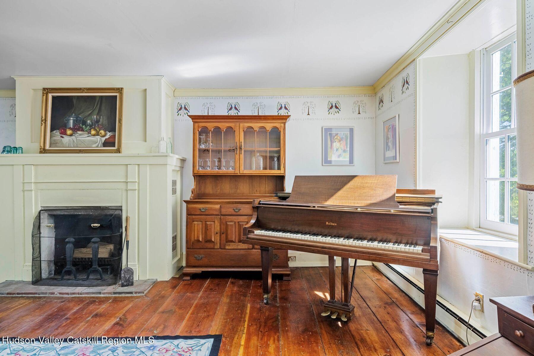 392-396 Cottekill Road Kingston, NY 12401 - Photo 12 of 34 a living room with furniture and a fireplace