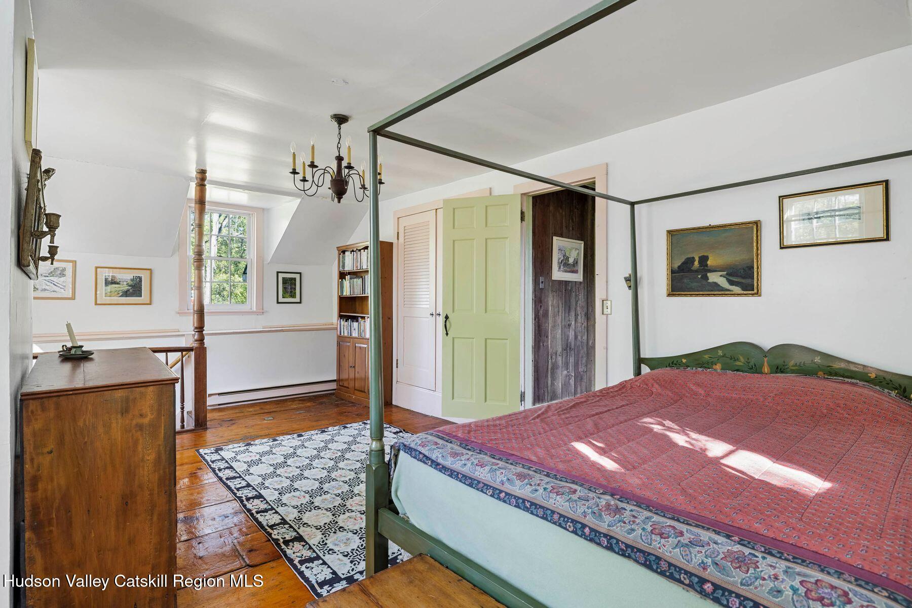 392-396 Cottekill Road Kingston, NY 12401 - Photo 17 of 34 a bedroom with a bed dresser and a window