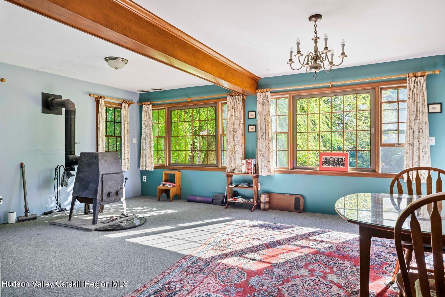 392-396 Cottekill Road Kingston, NY 12401 - Photo 19 of 34 a very nice looking bedroom with a large bed and large windows