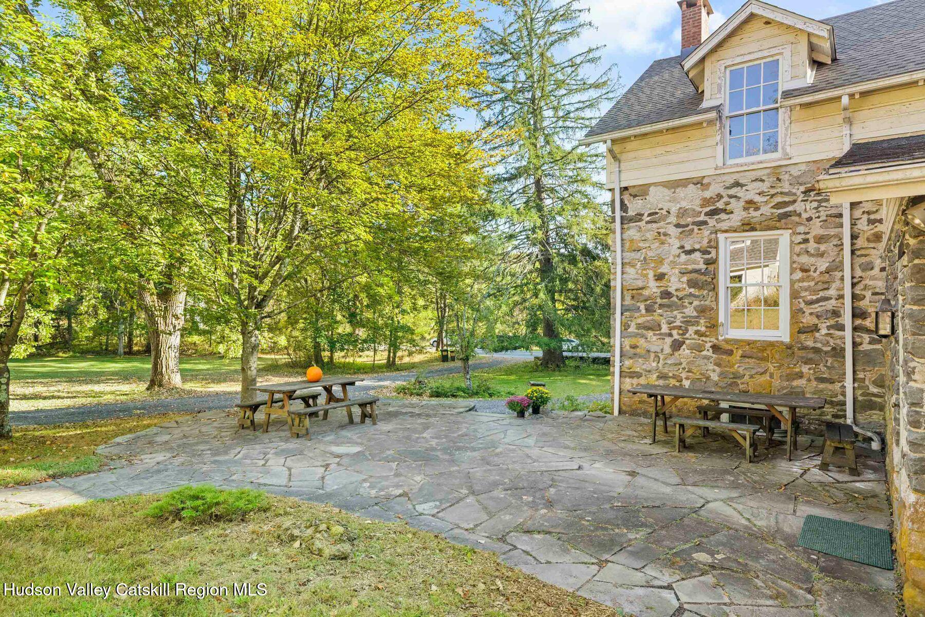 392-396 Cottekill Road Kingston, NY 12401 - Photo 2 of 34 a view of a patio with table and chairs and potted plants