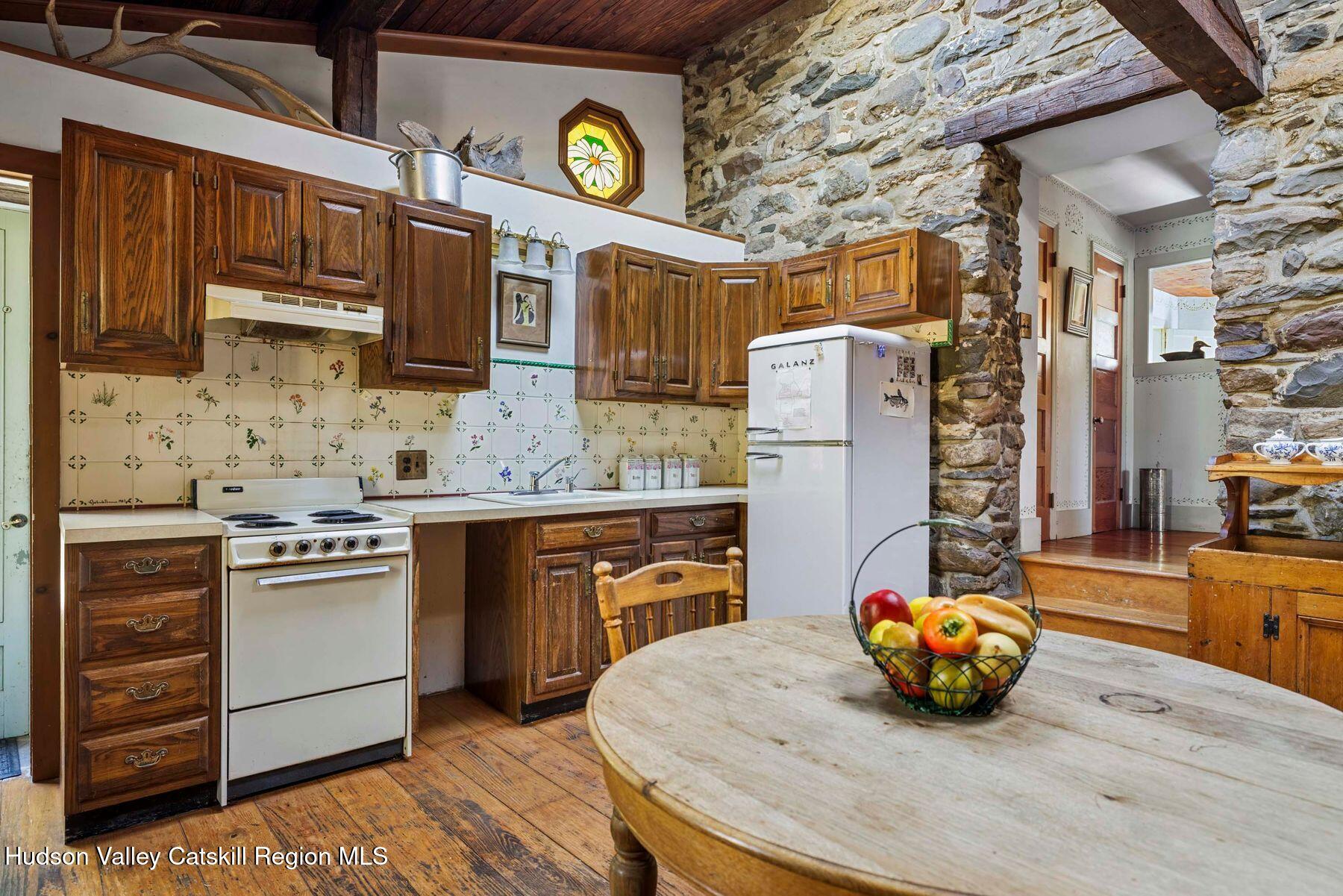 392-396 Cottekill Road Kingston, NY 12401 - Photo 3 of 34 a kitchen with stainless steel appliances granite countertop a sink stove and refrigerator