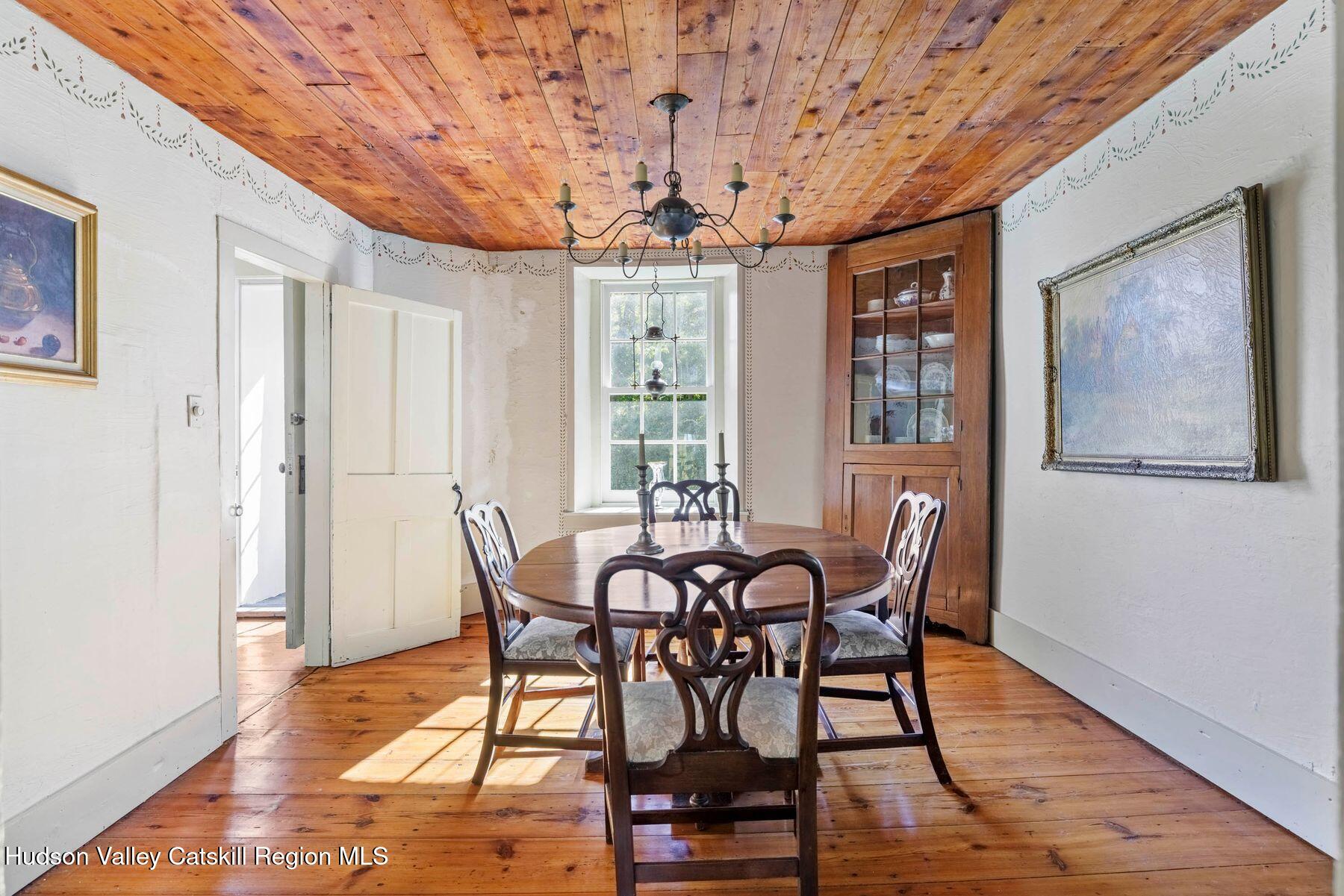 392-396 Cottekill Road Kingston, NY 12401 - Photo 9 of 34 a view of a dining room with furniture window and wooden floor