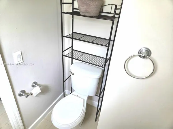 a view of a balcony with wooden floor