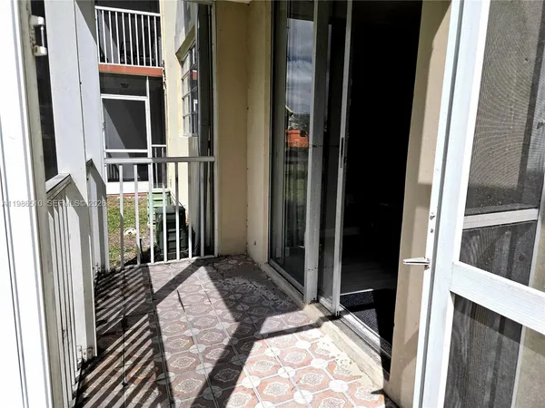 a view of a balcony with door