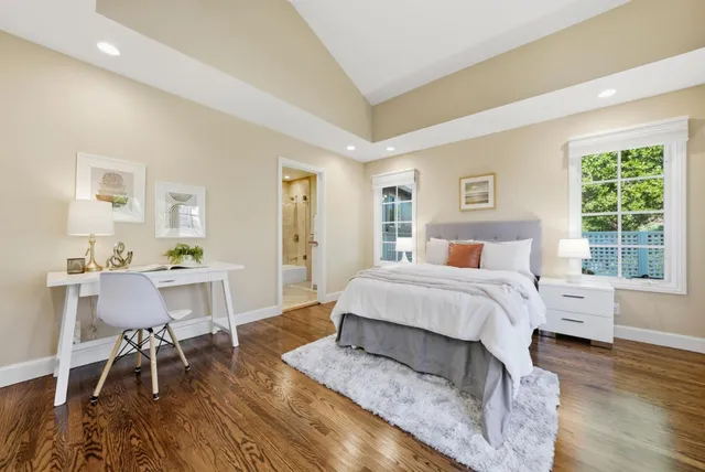 a bedroom with a bed and a table in it