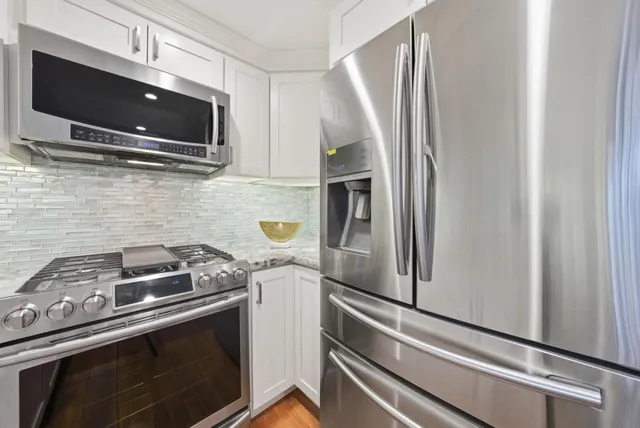 a kitchen with a stove and a microwave