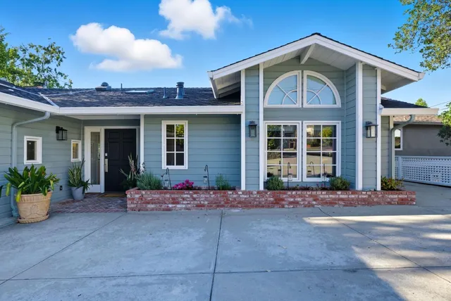 a front view of a house with yard