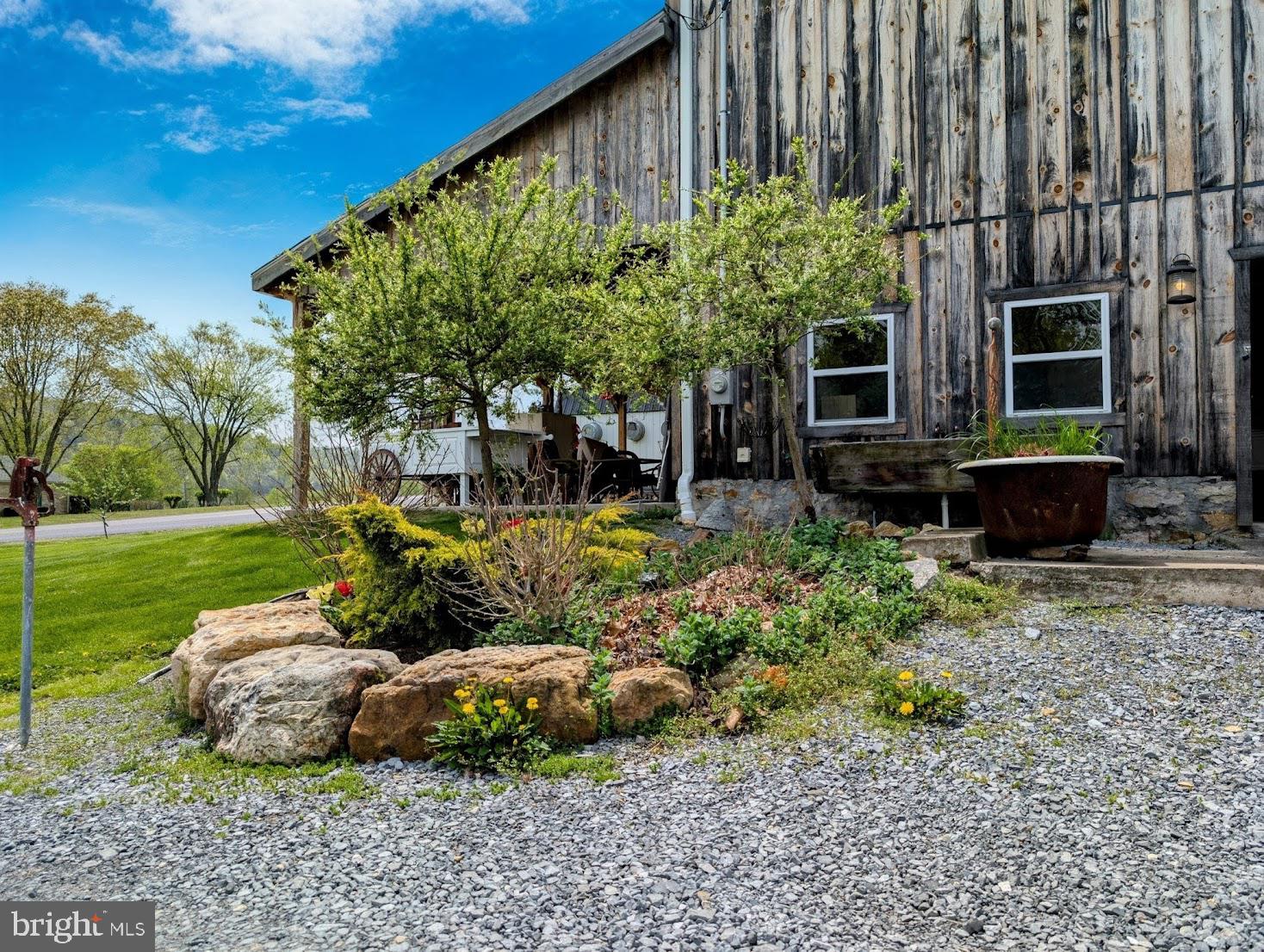1568 Cumberland Road Bedford, PA 15522 - Photo 17 of 37 a house with garden in front of it